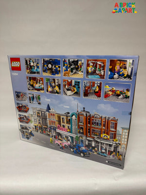 LEGO set box with various minifigure images and a city street scene on a white background