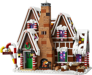 Legion gingerbread house with candy decorations on a white background