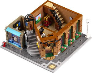 LEGO model of a detailed building with various elements on a white background