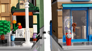Close-up of a LEGO model with a fire hydrant and store front