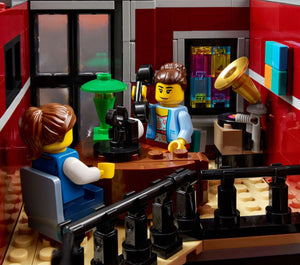 LEGO scene with two characters in a room with scientific equipment and a computer.