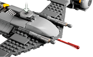 Close-up of a LEGO model of a spaceship with a red laser cannon on a white background