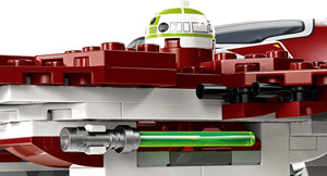 Close-up of a red and silver toy spaceship with a green laser pointer, on a white background.