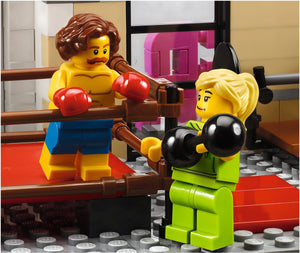 Two LEGO figures in a boxing match inside a LEGO ring.