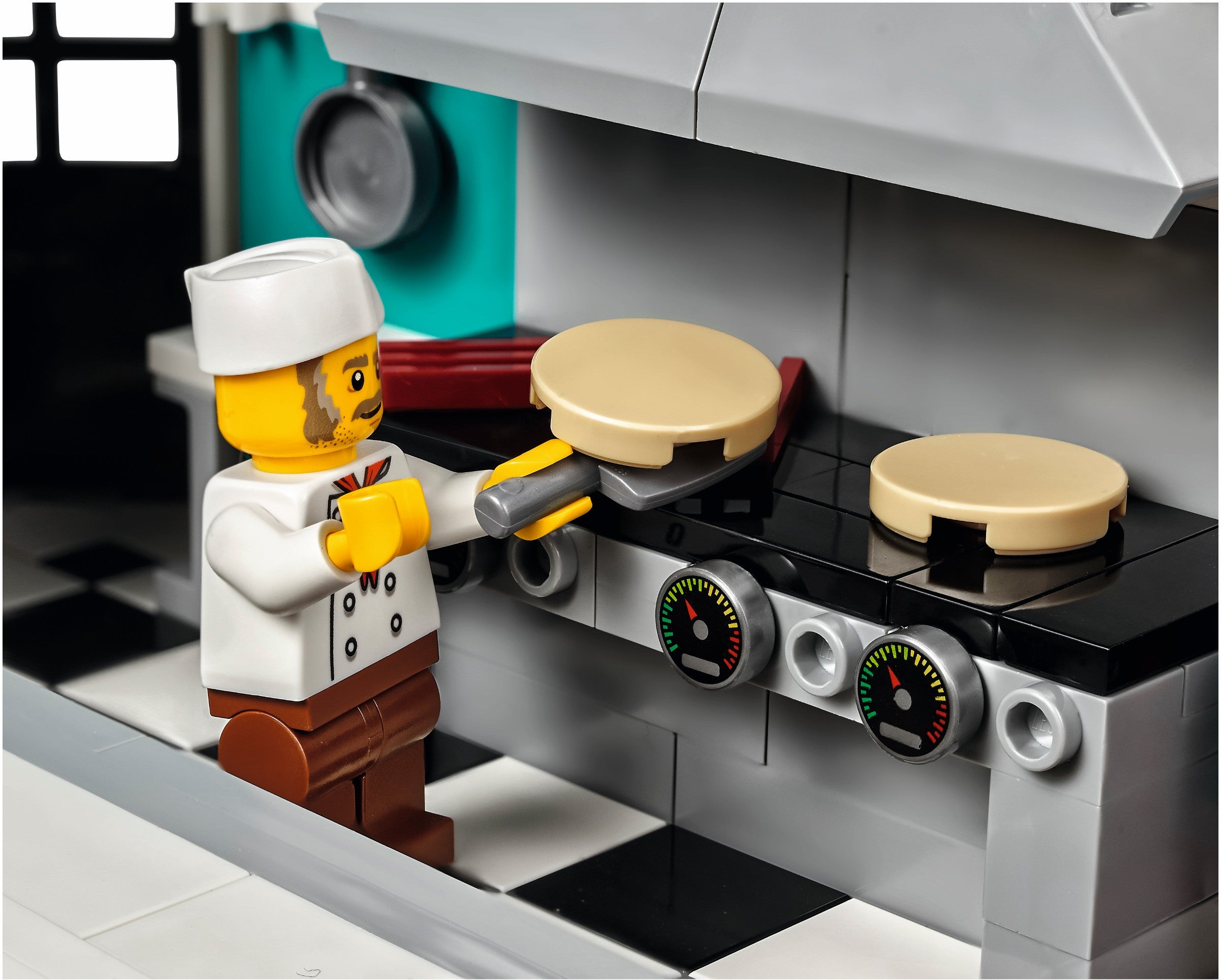 LEGO chef character cooking on a stove with pots and pans.