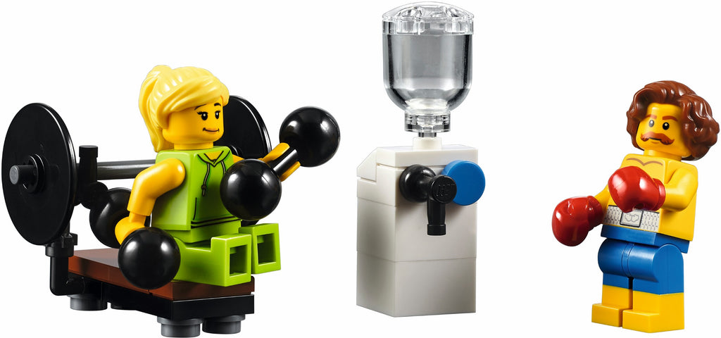 Two LEGO figures, one lifting weights and the other in boxing gloves, with a water fountain in the center.