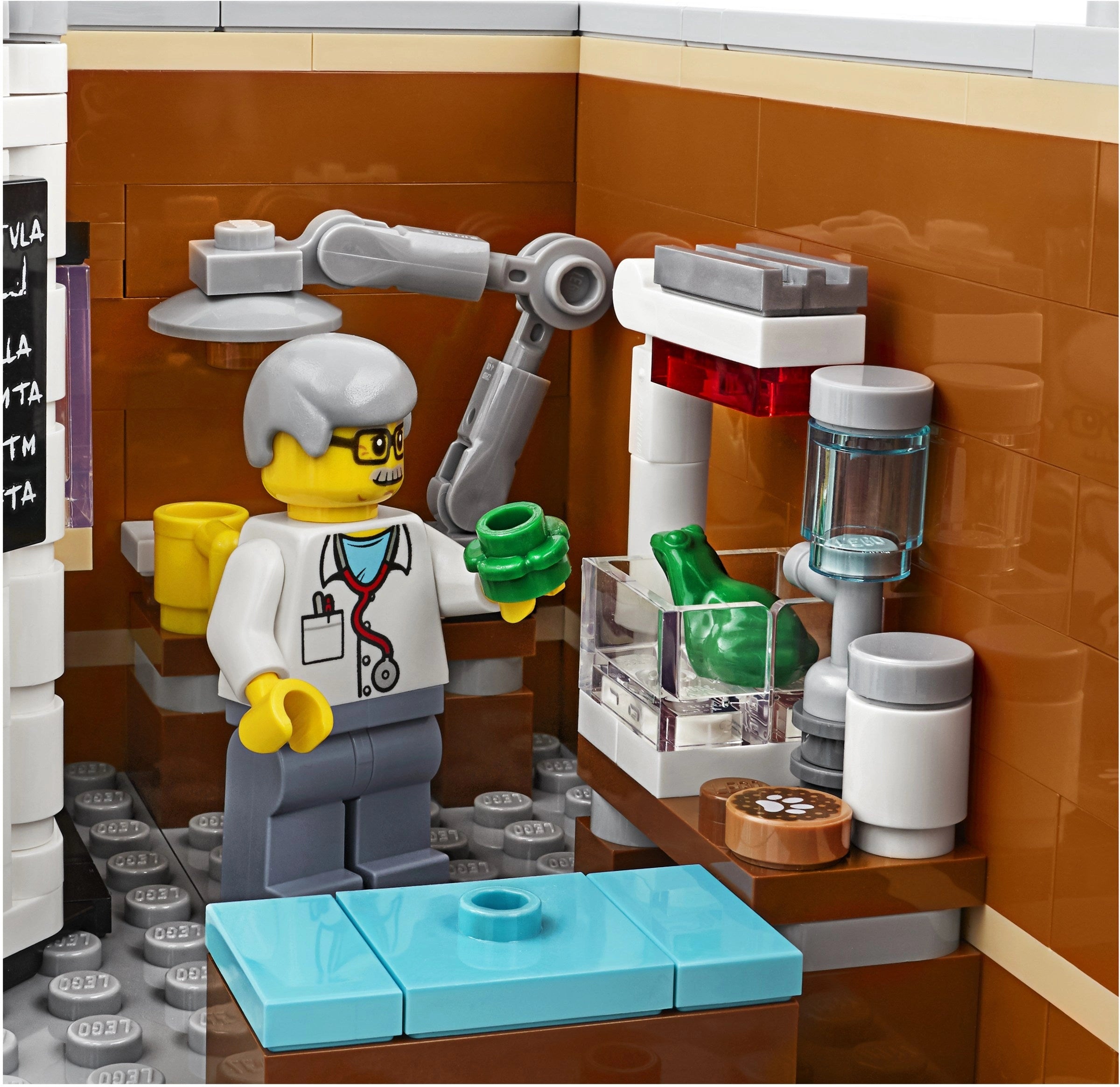 LEGO figure of a scientist in a lab setting with various scientific equipment.