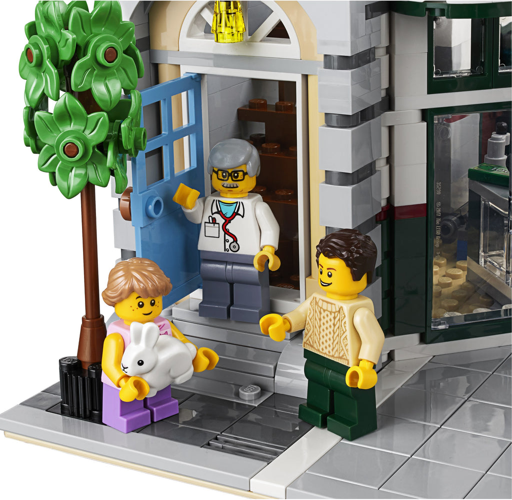 LEGO set with characters and a tree in front of a building