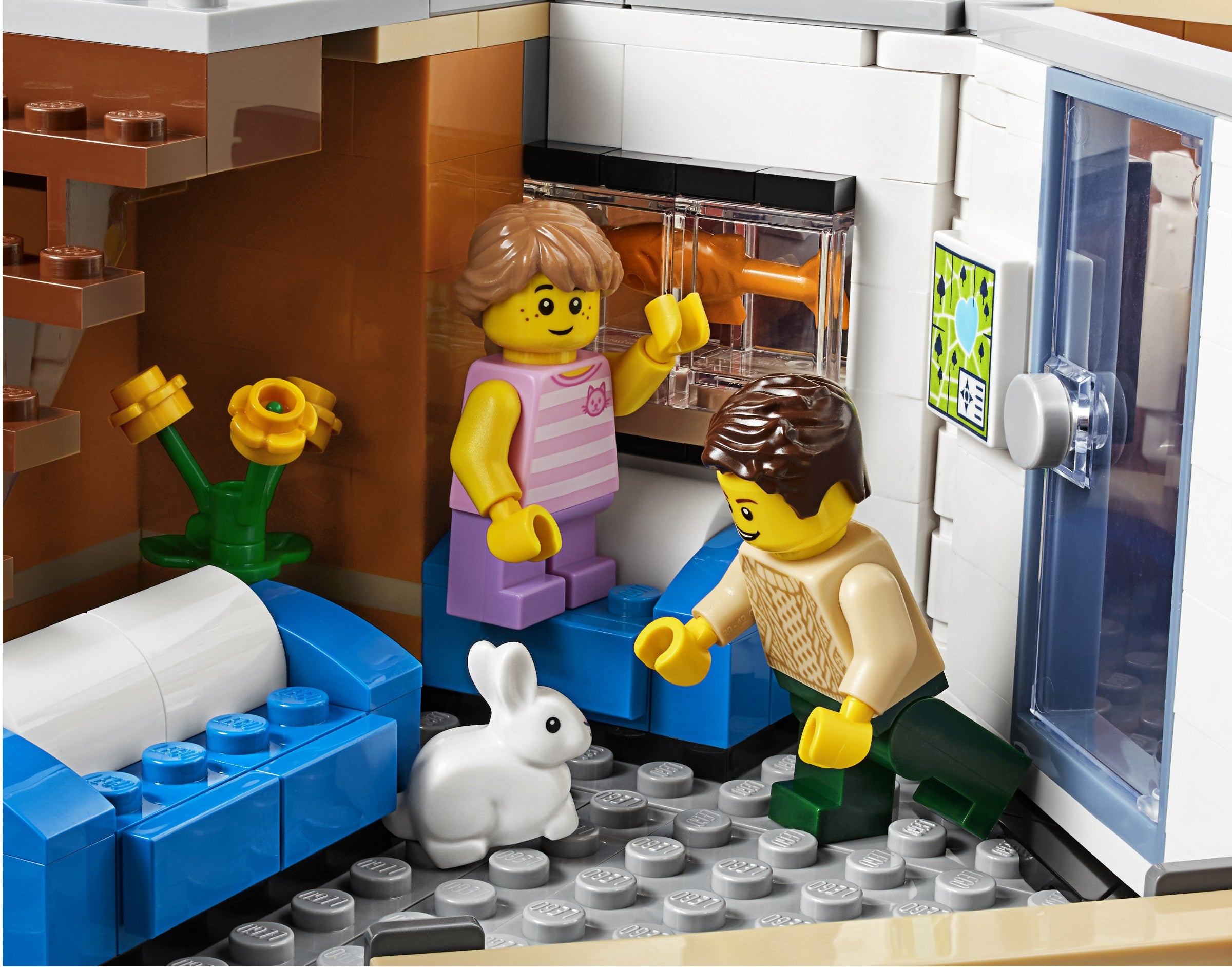 LEGO figures in a living room setting with a refrigerator and couch.