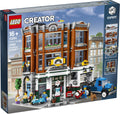 LEGO Creator Corner Garage set packaging with toy figures and vehicles on a city street background.