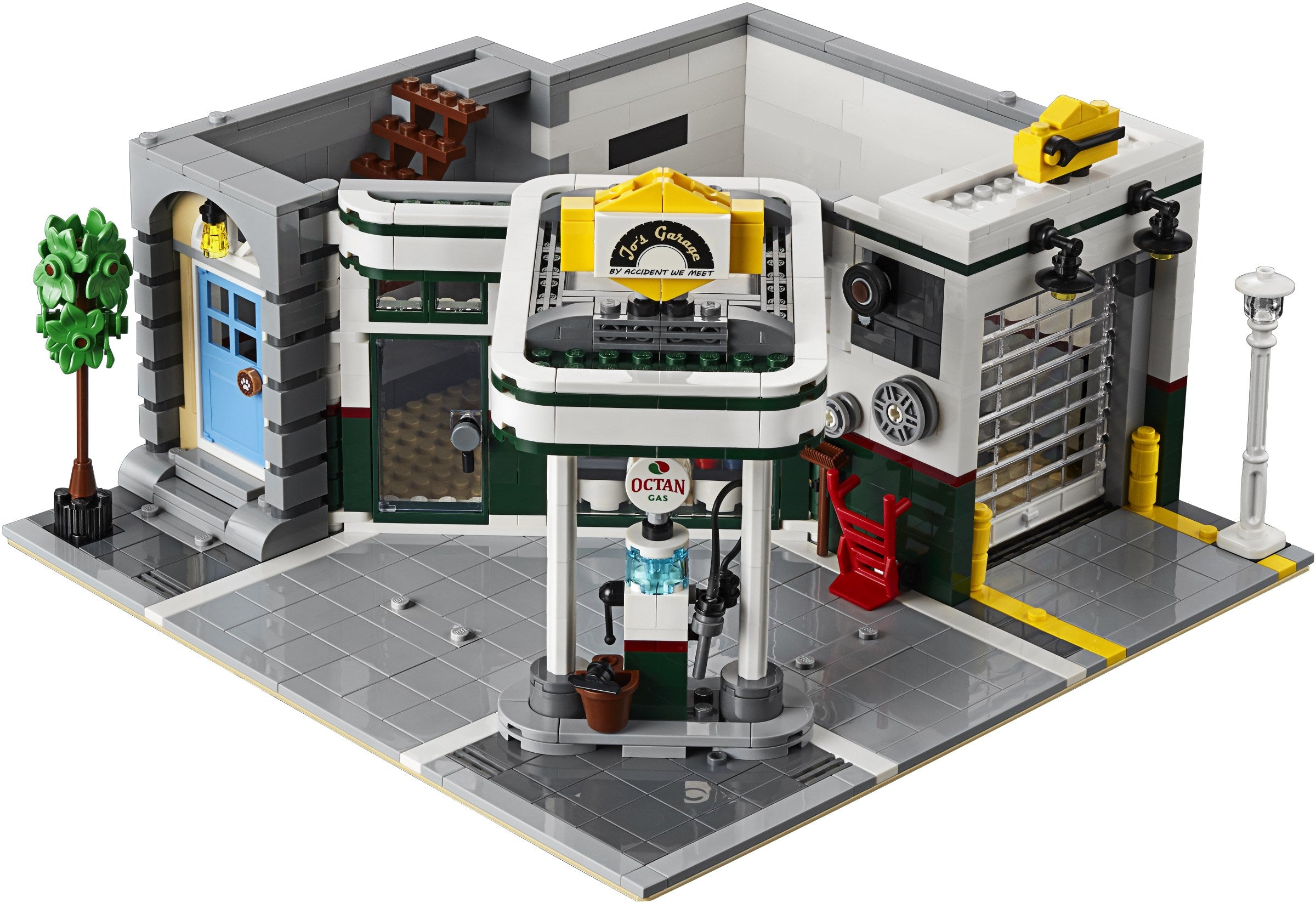 LEGO model of a gas station with various details on a white background