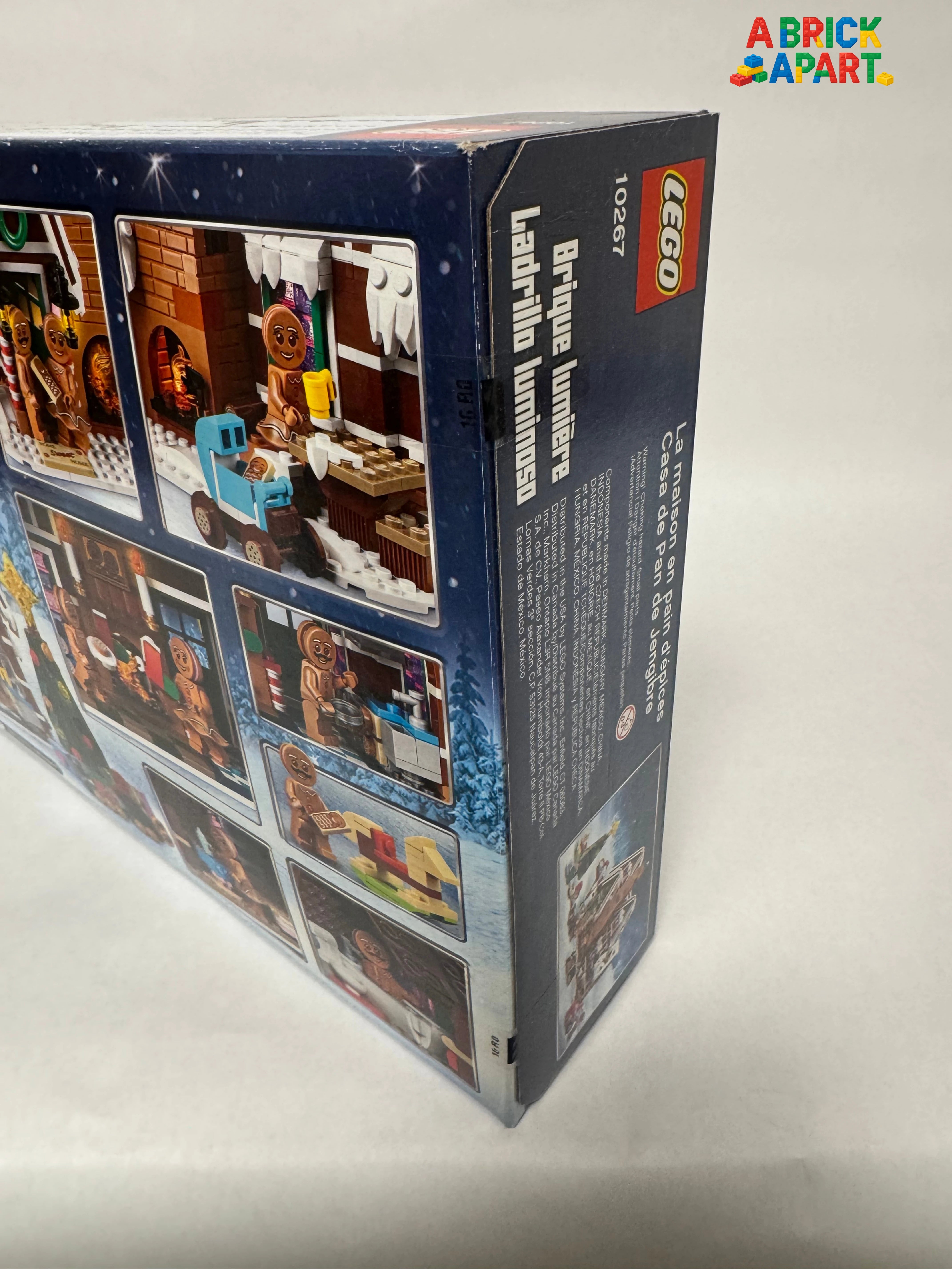 Back view of a LEGO set packaging with images and text on a light gray background.