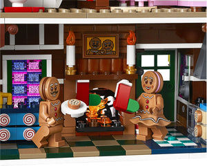 LEGO gingerbread men in a kitchen setting with a fireplace and checkered floor.