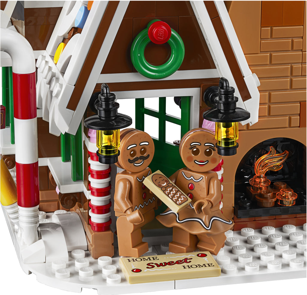 LEGO gingerbread house with animated gingerbread men and candy decorations
