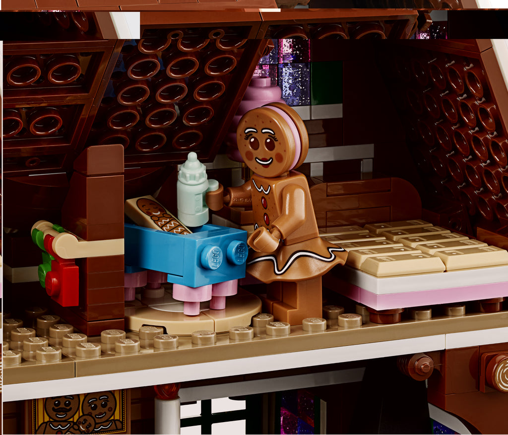LEGO gingerbread man character with a baby bottle in a kitchen setting