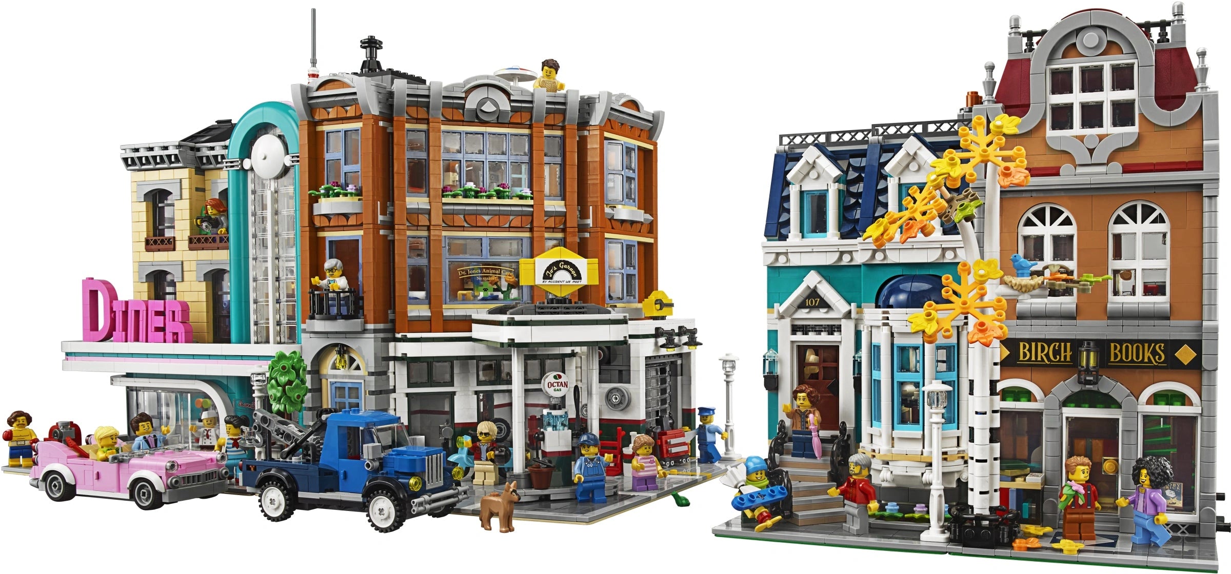LEGO model of a small town with buildings and people on a white background
