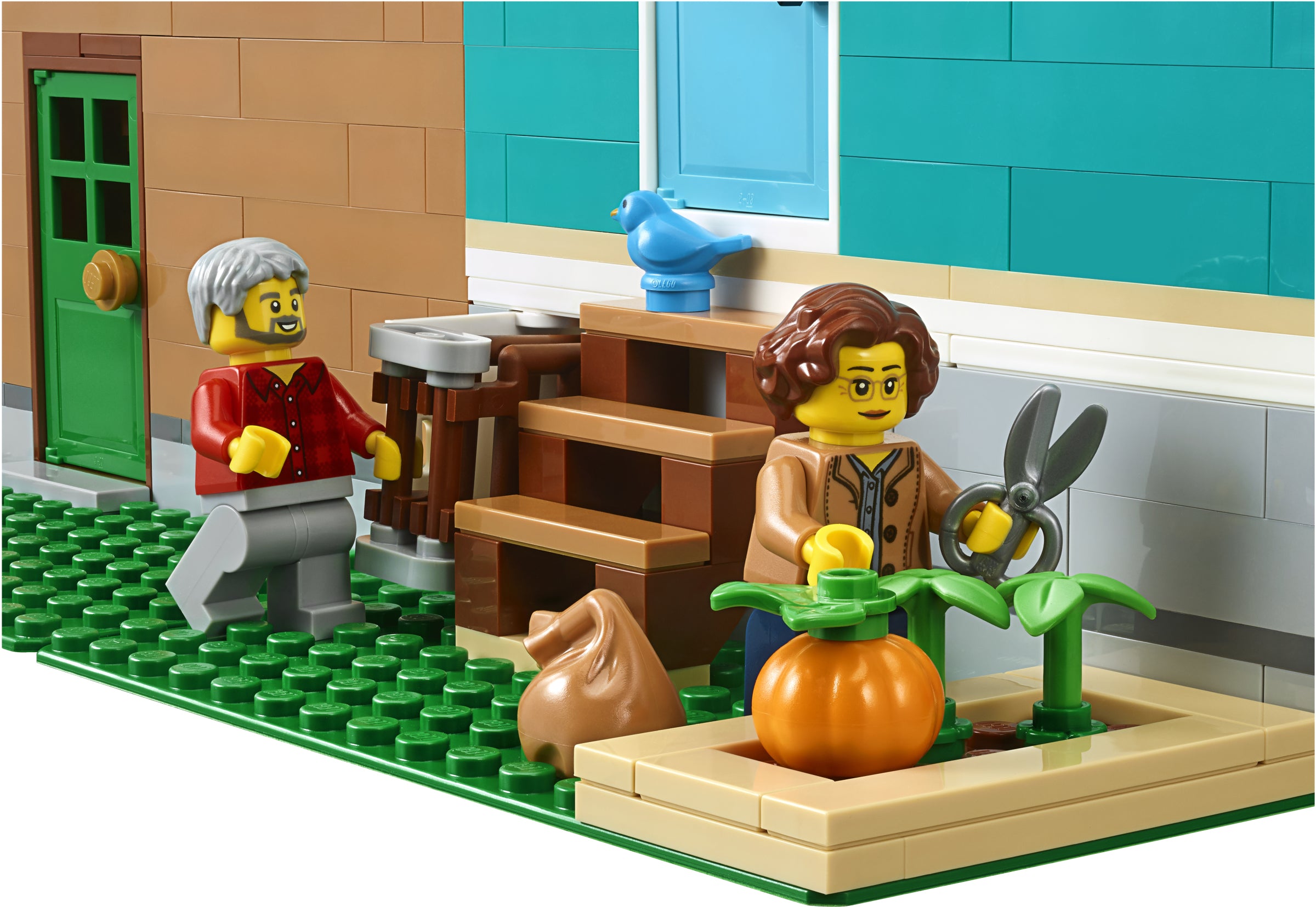 LEGO set with two characters and a small garden on a green baseplate.