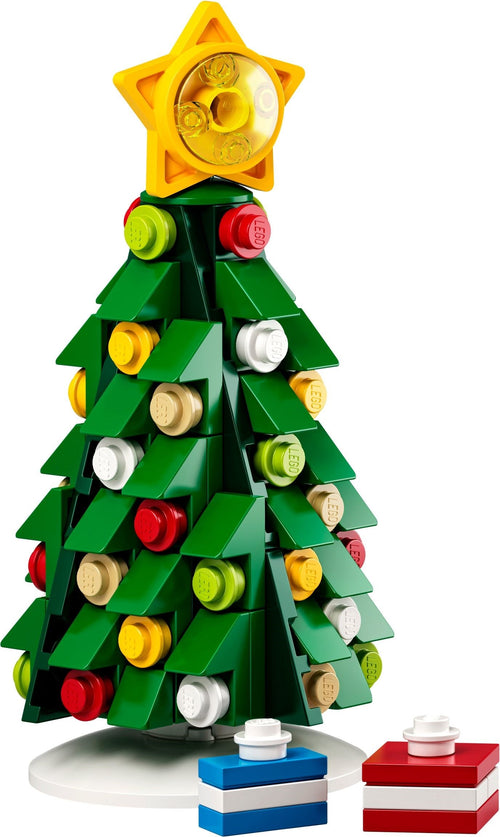 Toy Christmas tree made of interlocking bricks with colorful decorations on a white background