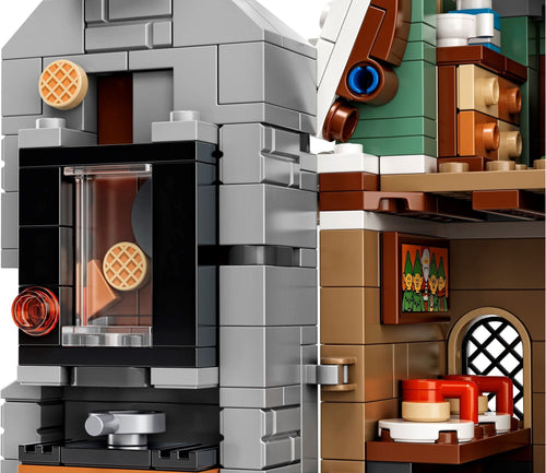 Close-up of a LEGO model of a coffee shop interior with a waffle and coffee cup.