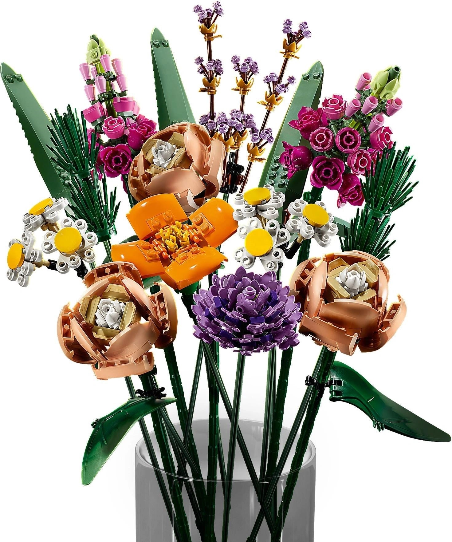 Colorful bouquet of flowers made from LEGO bricks in a clear vase on a white background