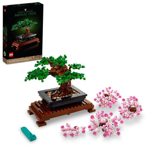 LEGO bonsai tree set with packaging, tree, and cherry blossom branches on a white background