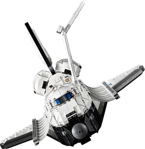 Model of a space shuttle made from interlocking bricks on a white background