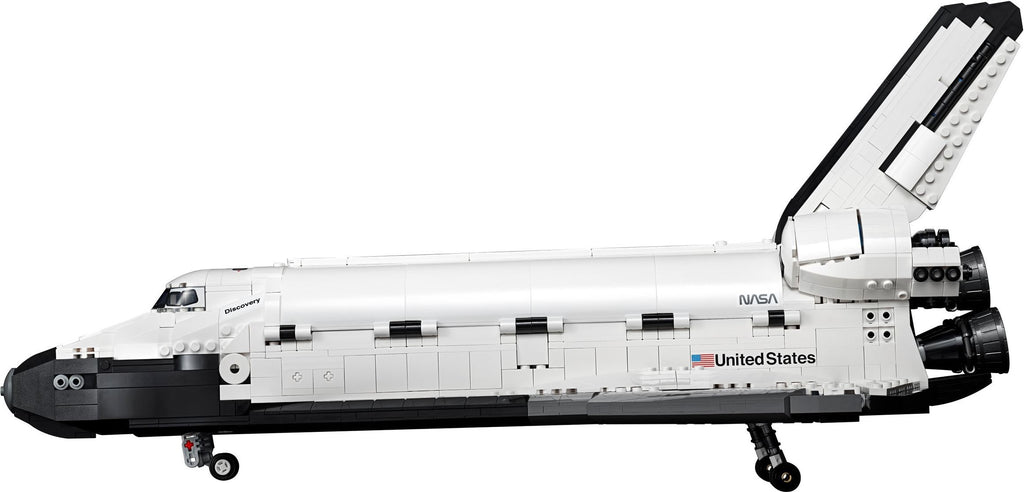 Model of a space shuttle with NASA branding on a white background