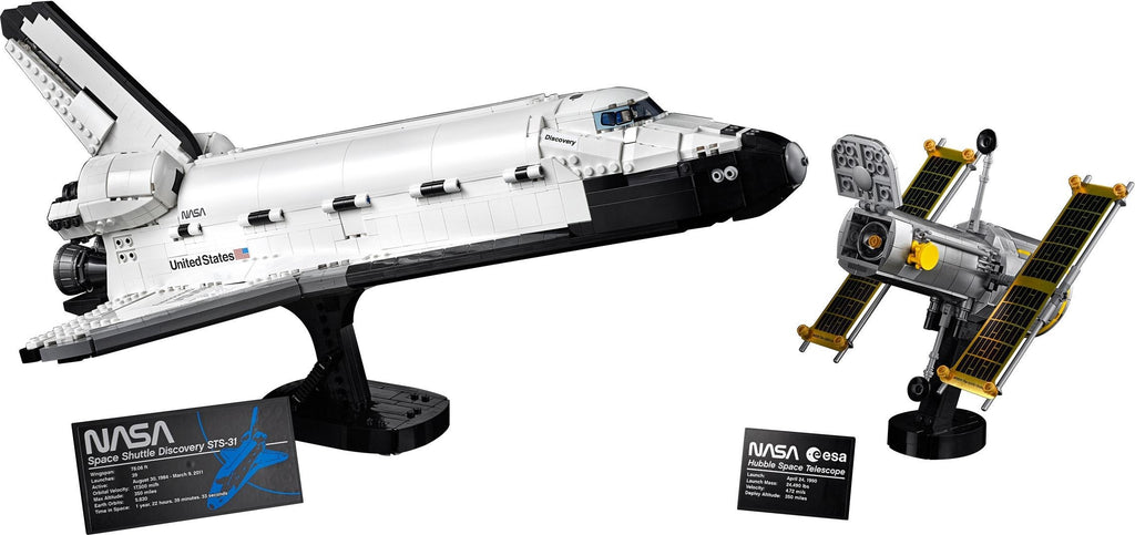 Model of a space shuttle and satellite with NASA branding on a white background