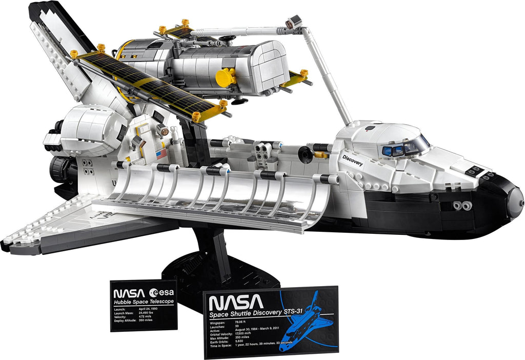 Model of a space shuttle on a stand with NASA branding