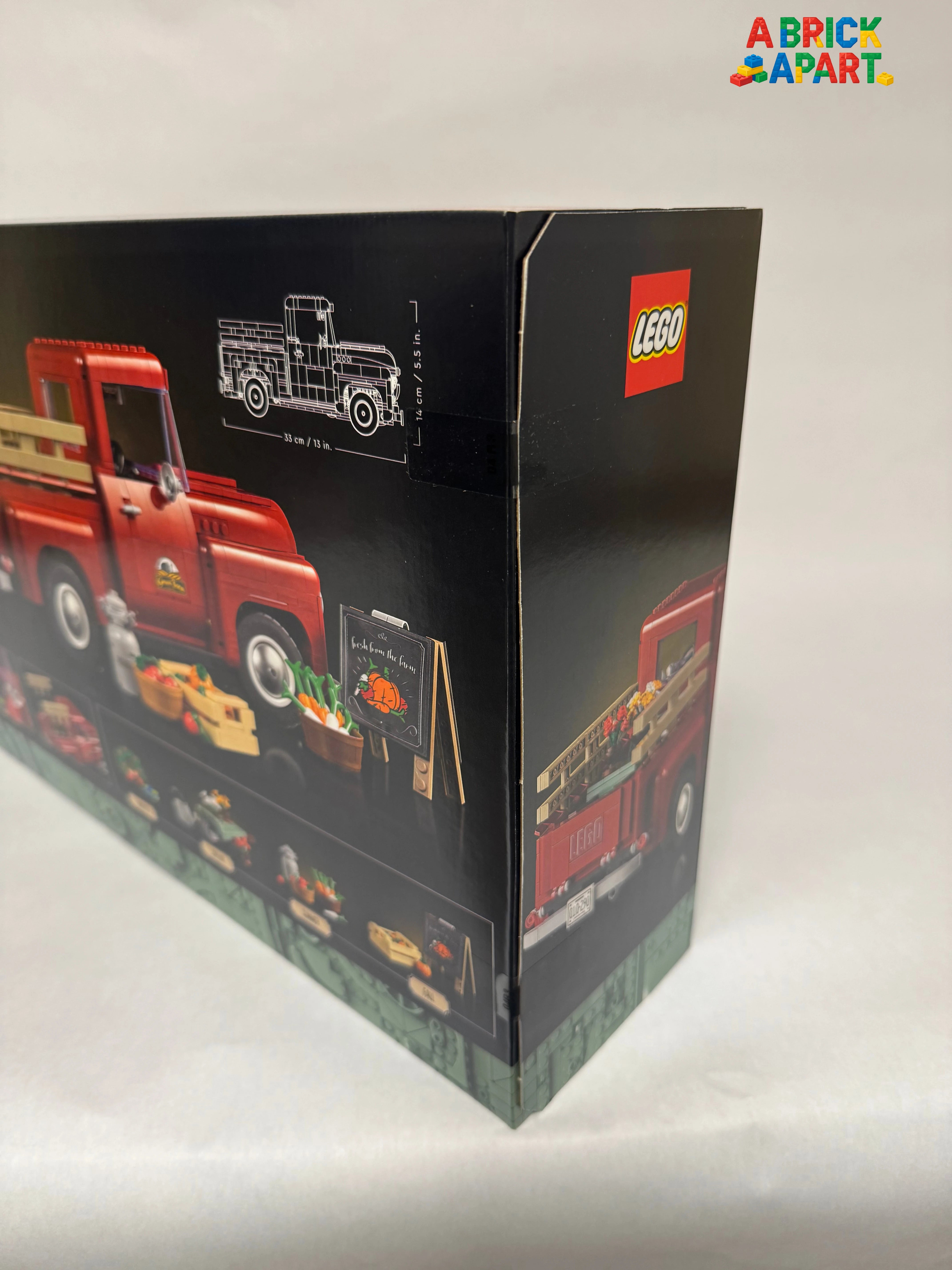LEGO truck set packaging with red truck illustration on a white background