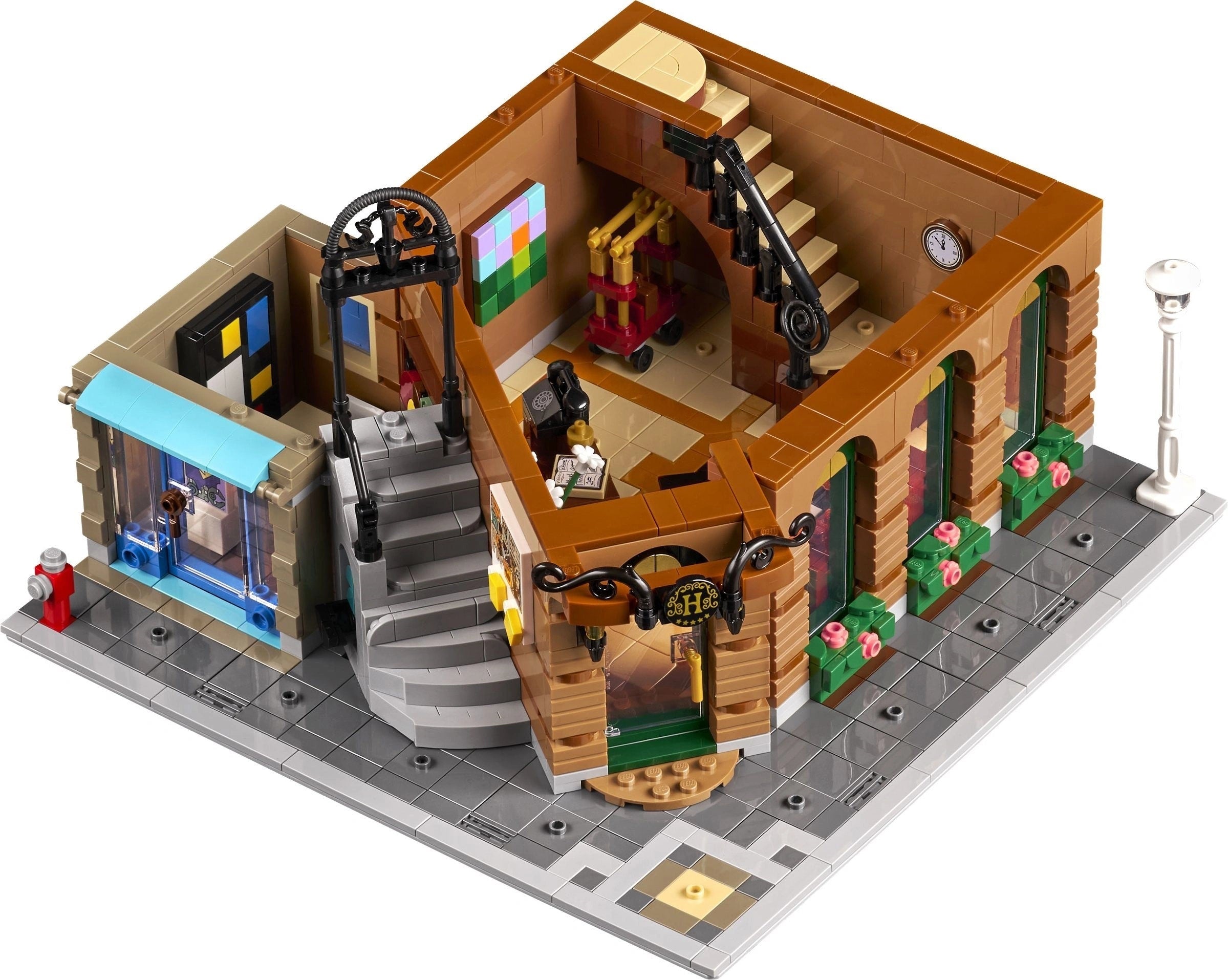 LEGO model of a detailed building with various elements on a white background