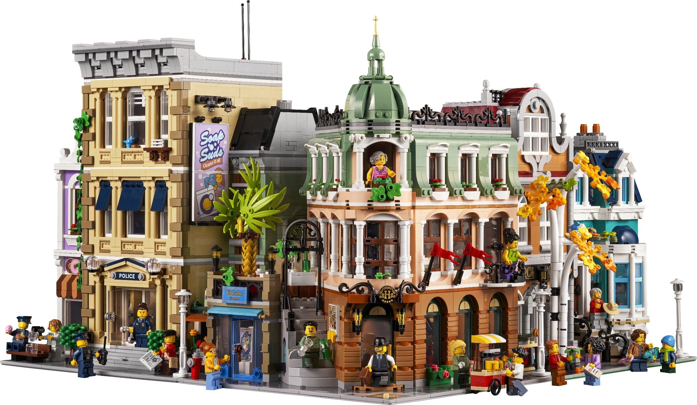 Detailed LEGO model of a city street with various buildings and figures.