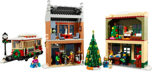 LEGO set of a festive town square with buildings, a trolley, and Christmas decorations.