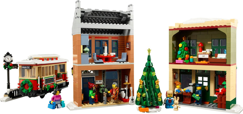 LEGO set of a festive town square with buildings, a trolley, and Christmas decorations.