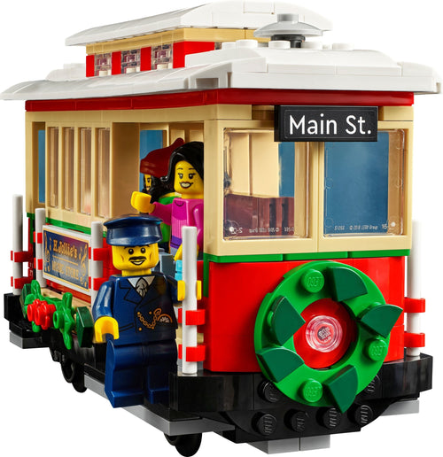 LEGO trolley with characters and 'Main St.' sign on a white background