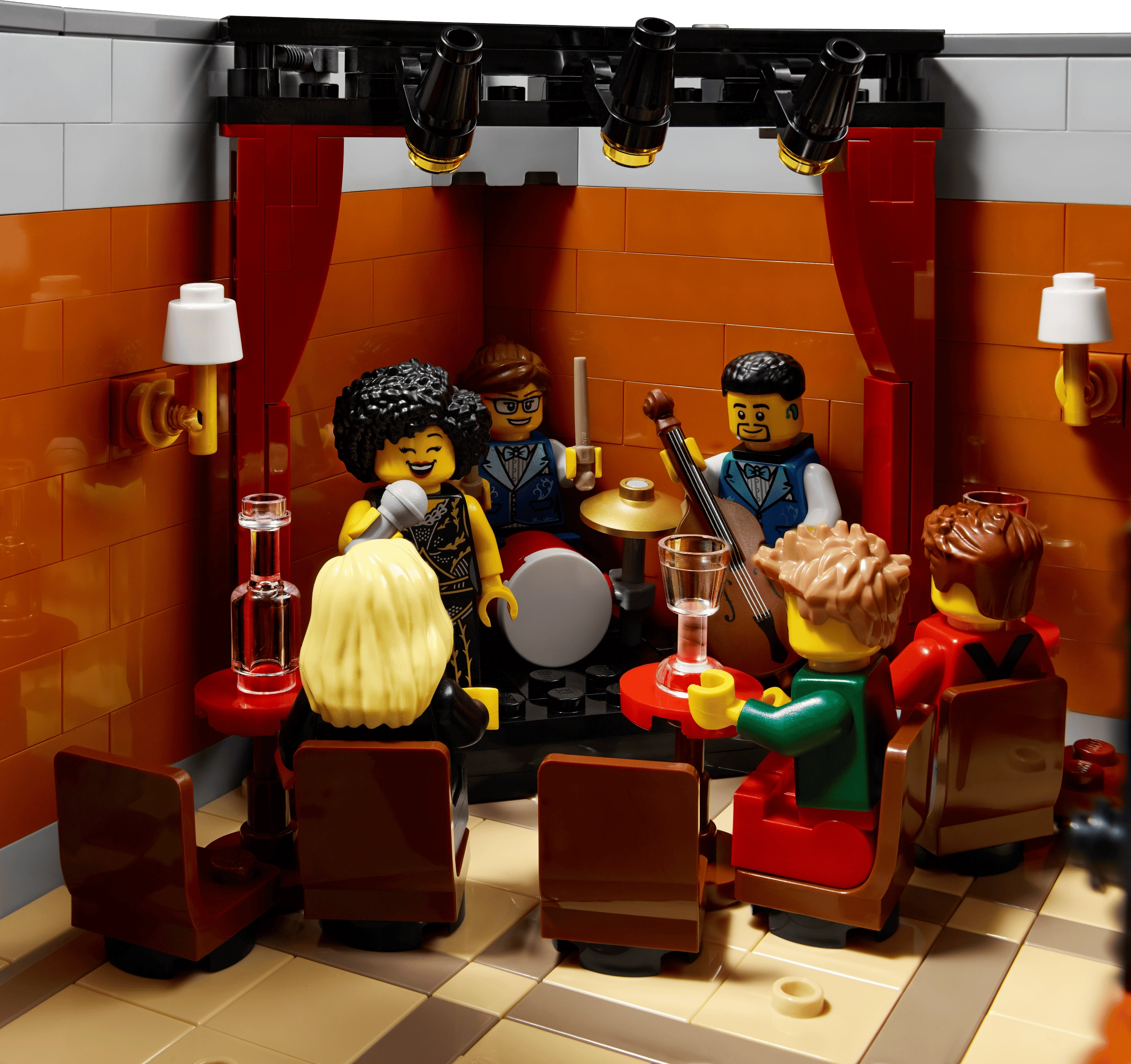LEGO set with characters in a bar setting, complete with furniture and props.