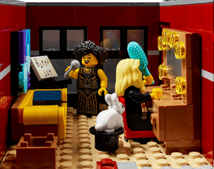 LEGO scene with characters in a room with furniture and decor