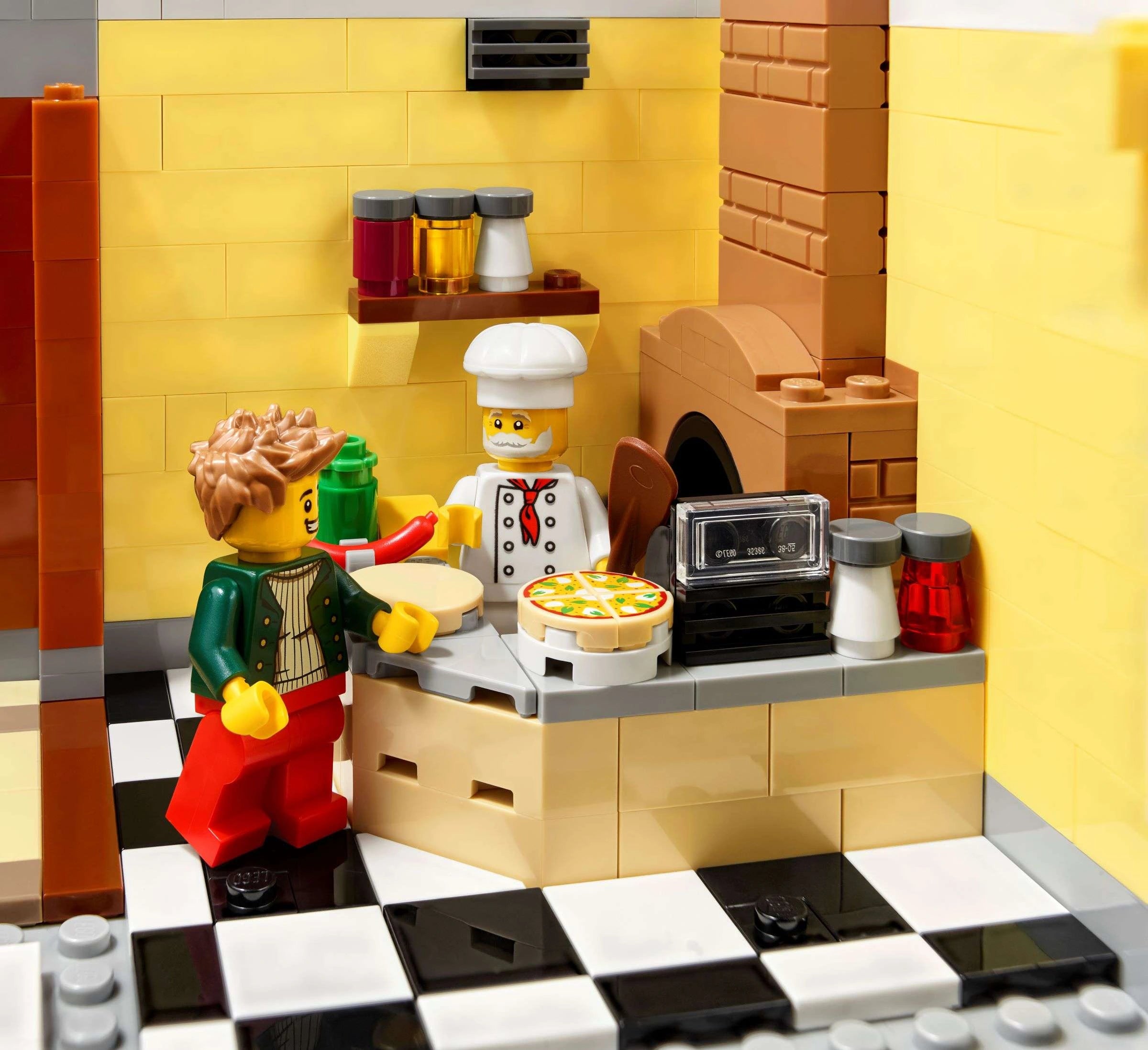 LEGO kitchen set with a chef and customer in a restaurant setting