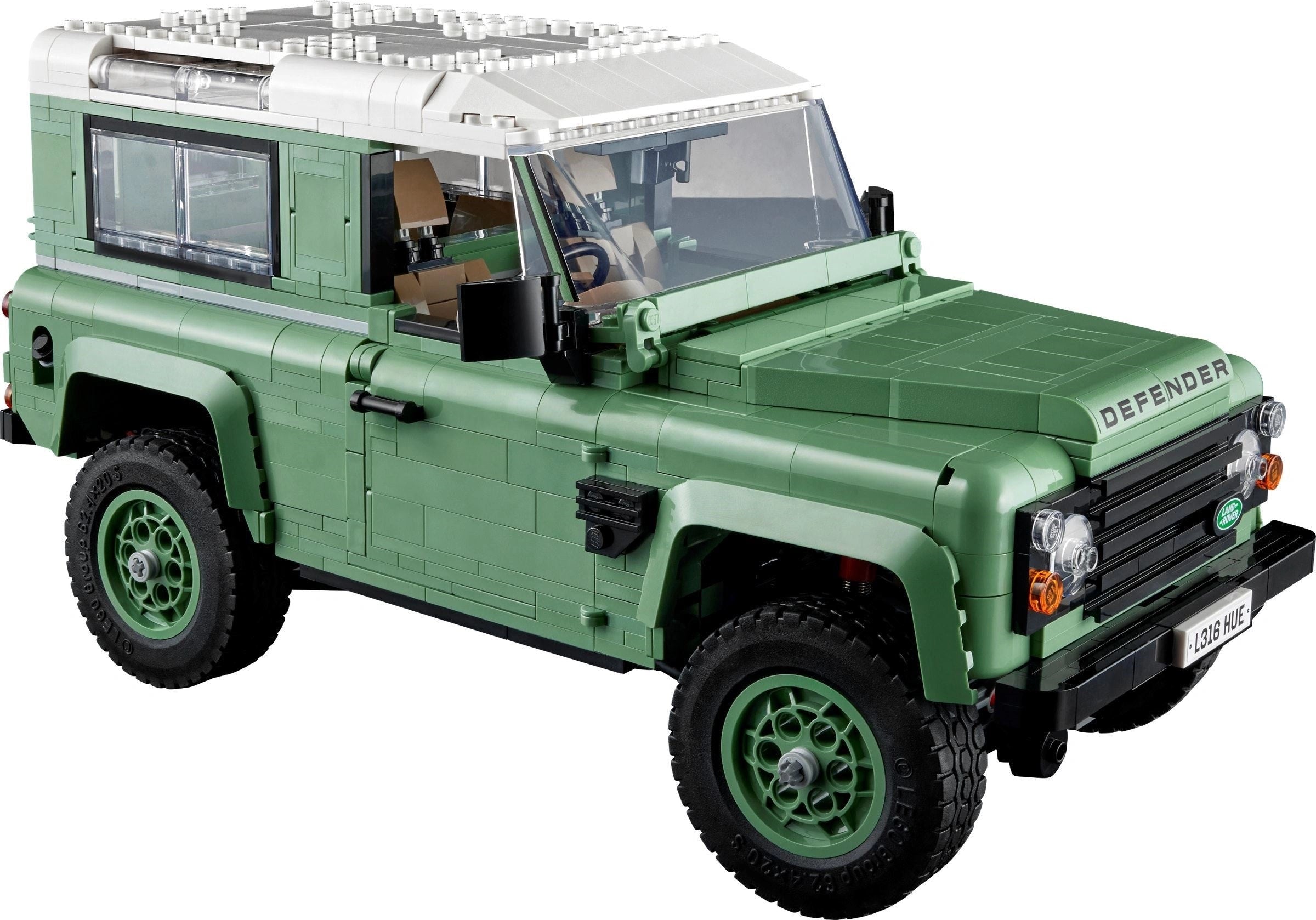 Green Land Rover Defender model on a white background