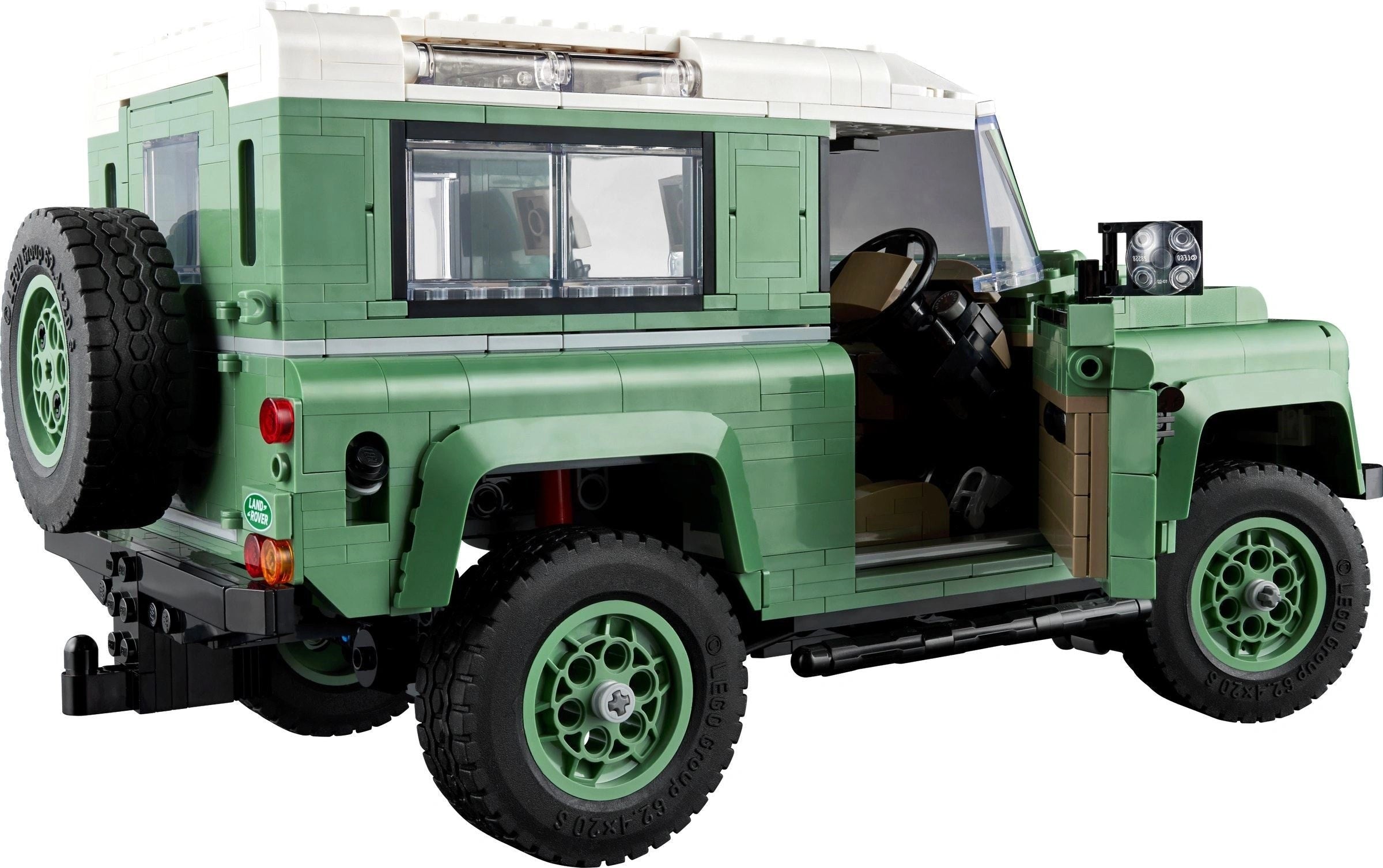 Green toy SUV with open door on a white background