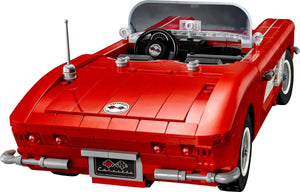 Red toy car model on a white background