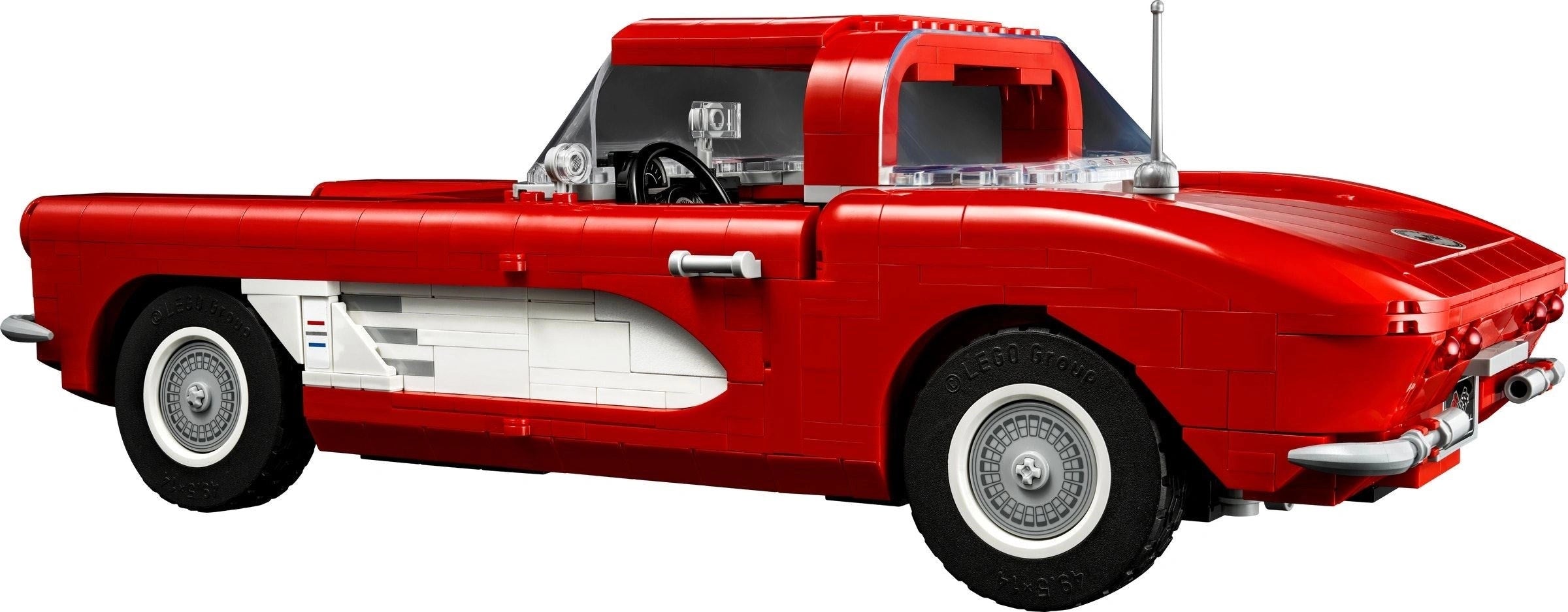 Red classic car model on a white background