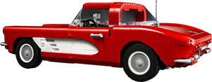 Red classic car model on a white background