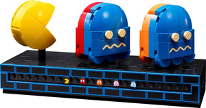 LEGO Pac-Man characters and ghosts on a black platform with colorful ghosts in the background