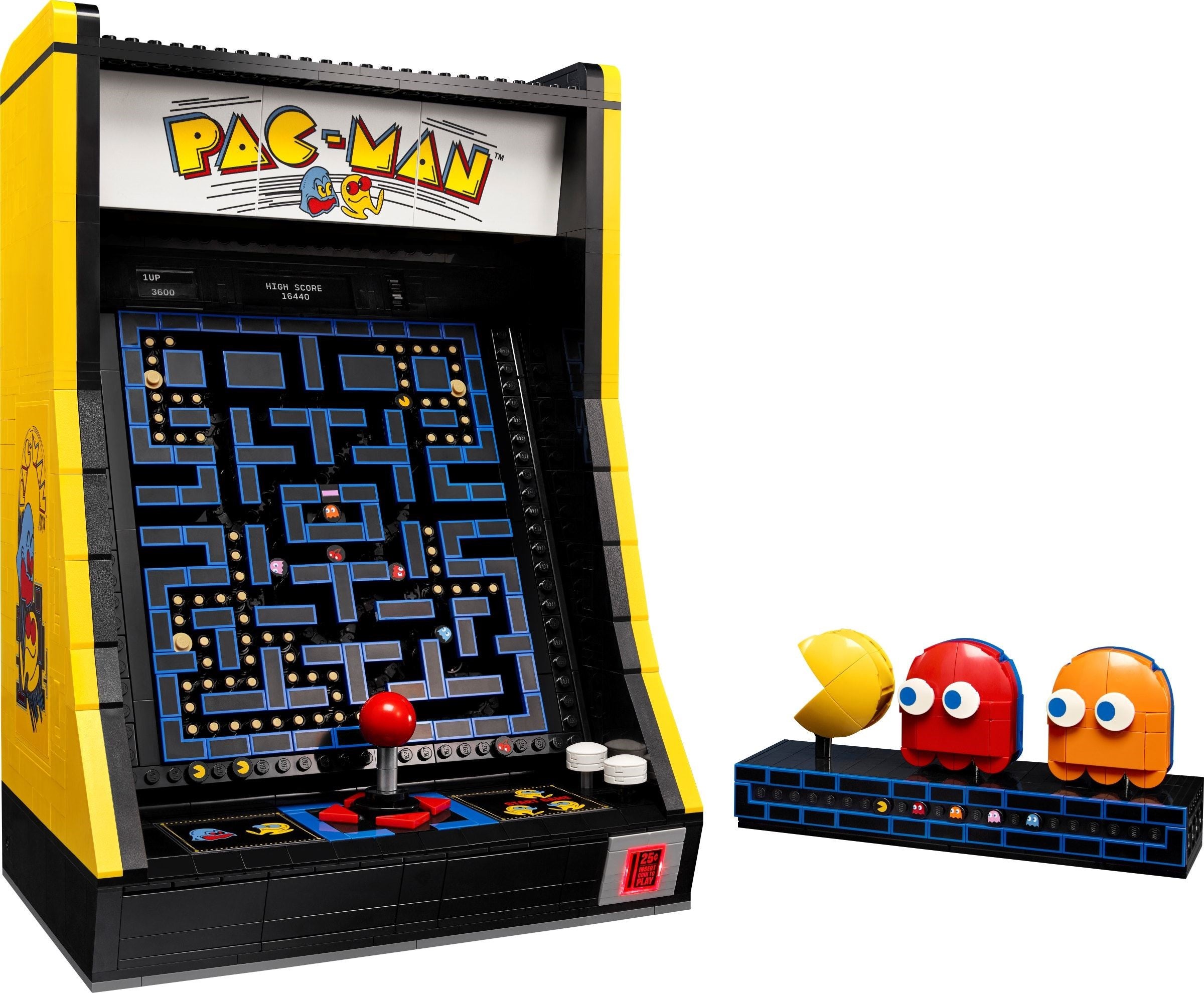Pac-Man arcade machine model with character figures on a white background