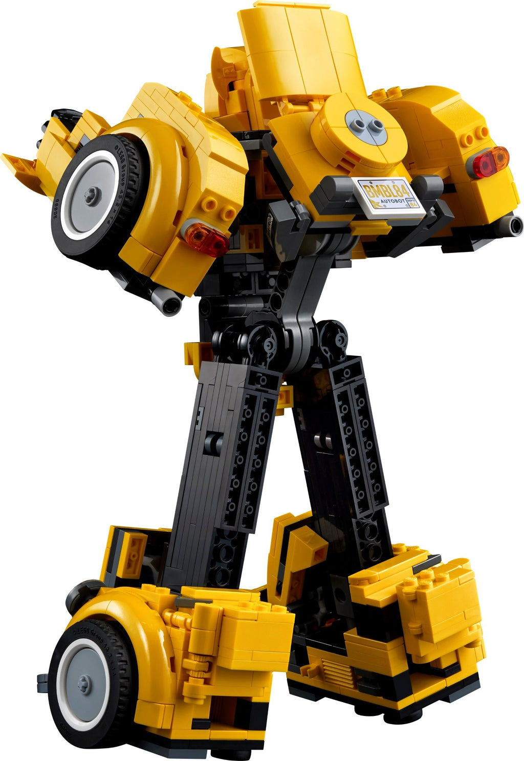 Yellow and black robot model made of interlocking bricks on a white background