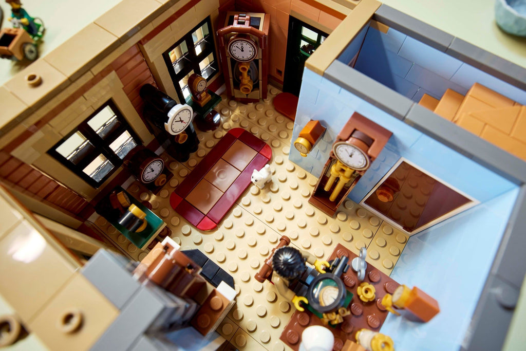 Close-up of a detailed LEGO model of an office with furniture and decor.