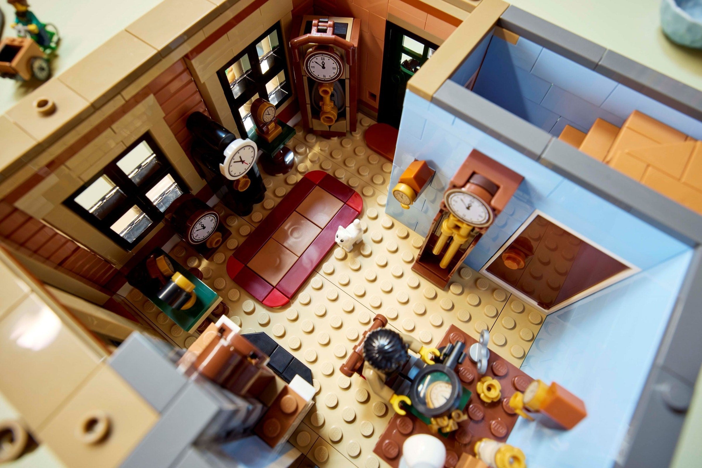 Close-up of a detailed LEGO model of an office with furniture and decor.