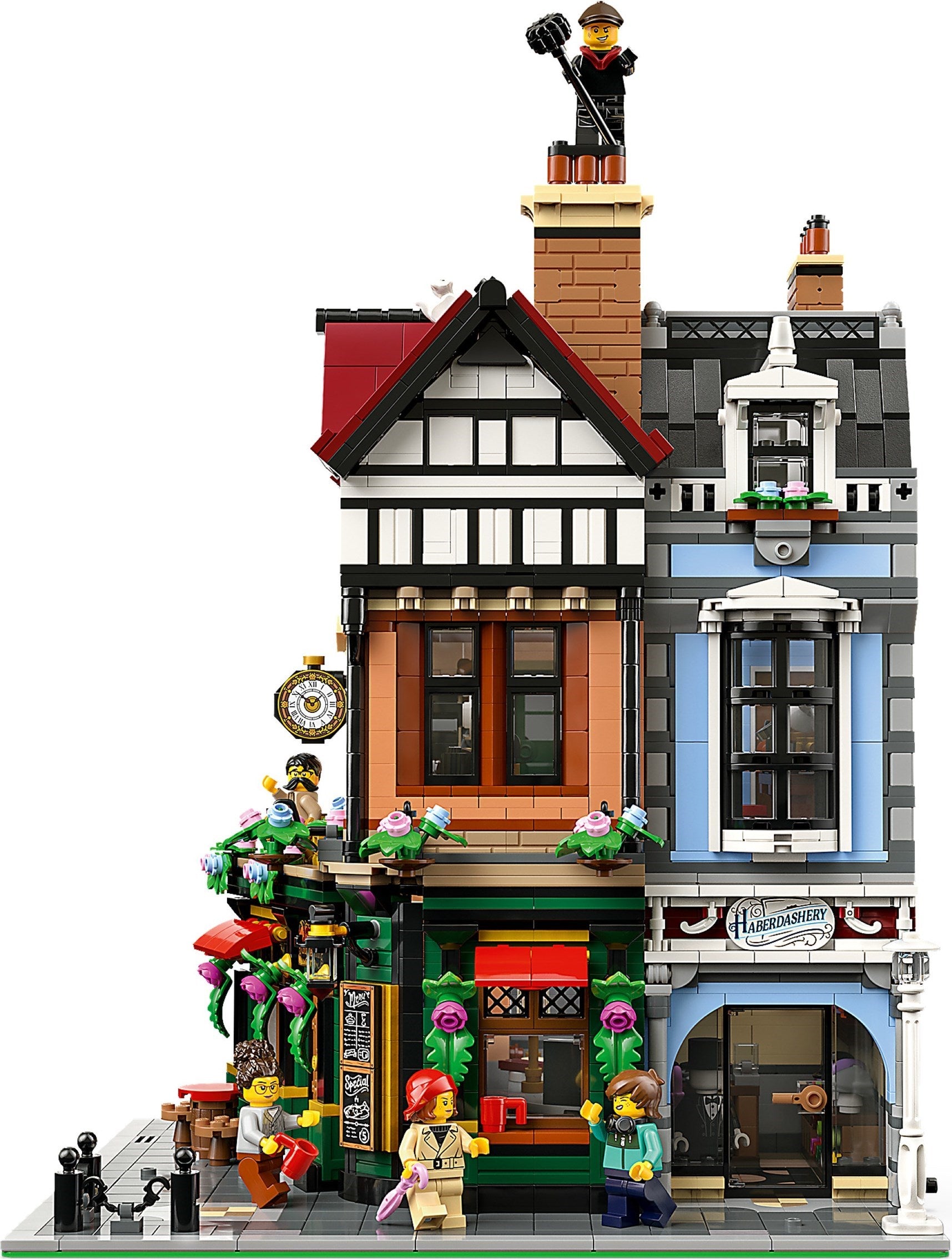 Detailed LEGO model of a townhouse with various elements and figures on a white background