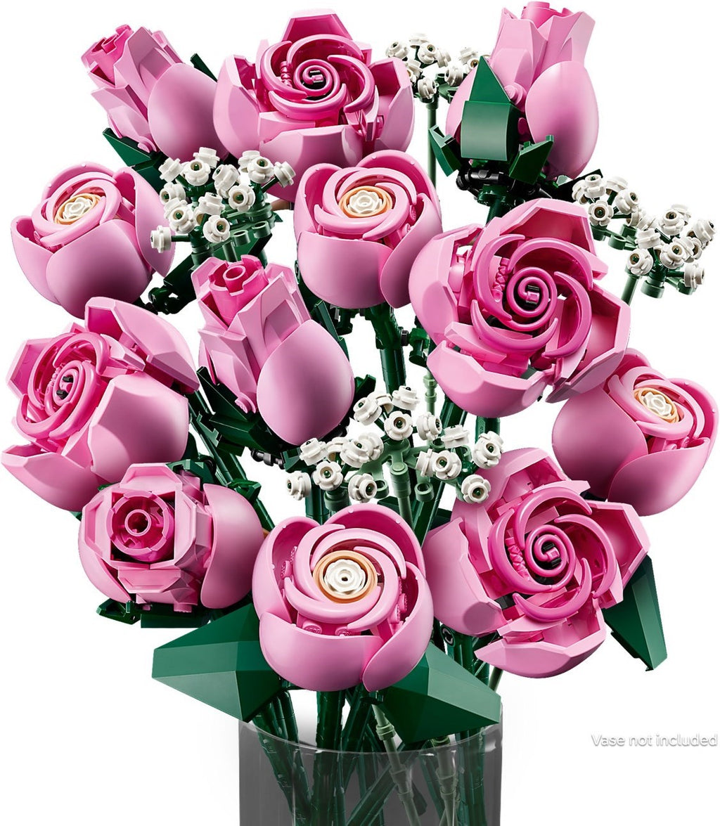 Bouquet of pink roses with a clear vase on a white background